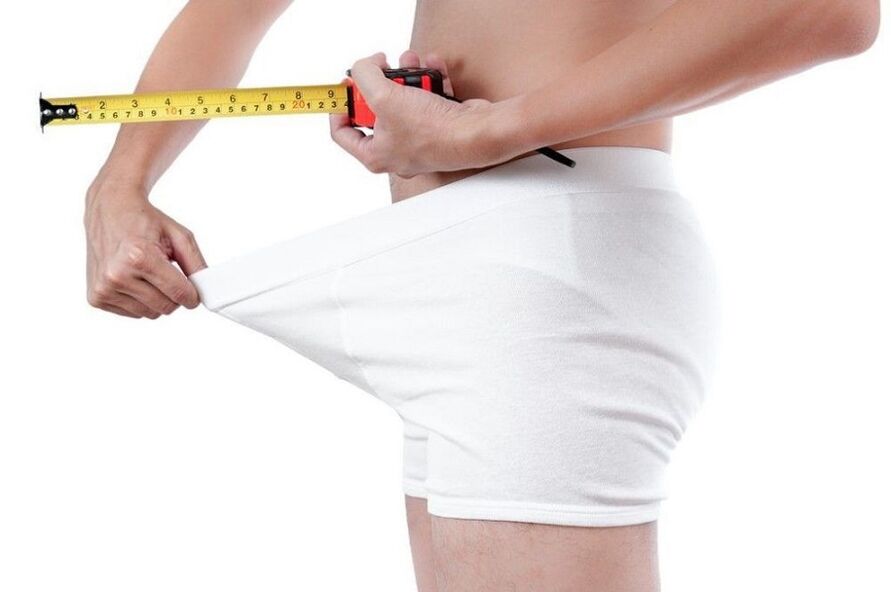 Measuring the penis before enlargement exercises.